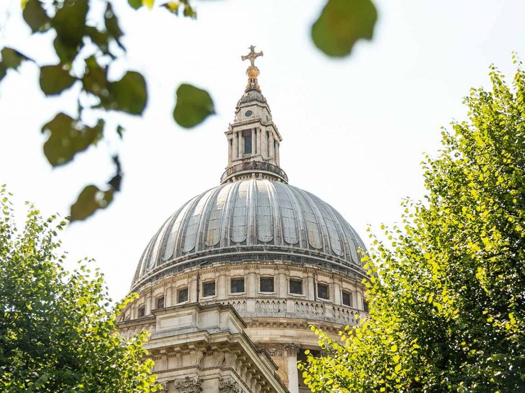 tour guide discussing one of the domes at St Pauls Cathedral in London.