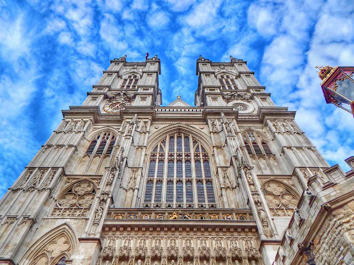 Guests at the entrance of Westminster Abbey with their tour guide.