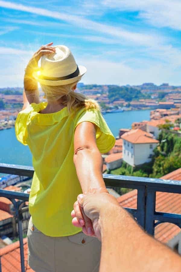 Woman leading a person to look at the view.