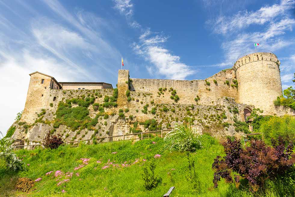 External view looking up at walls of Fortress of Castrocaro Terme, Italy