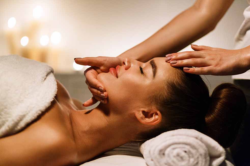 woman enjoying a massage at a health spa in italy.