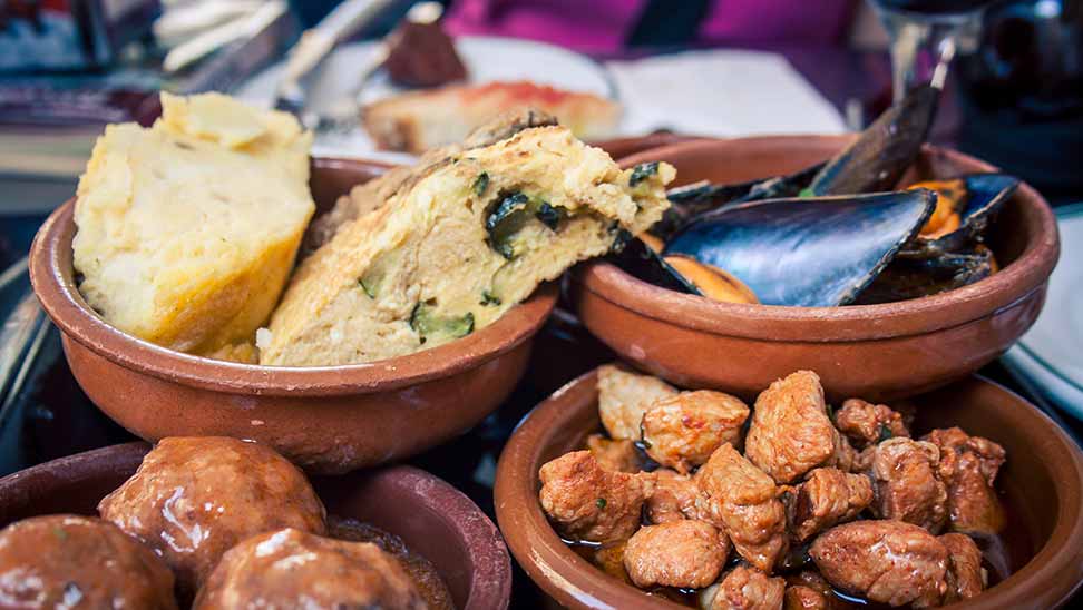 close up of 4 Tapas dishes in Barcelona