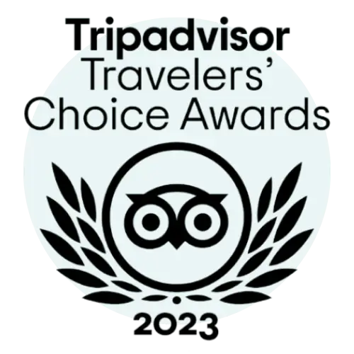 2023 TripAdvisor Travelers' Choice Awards logo featuring an owl within a laurel wreath