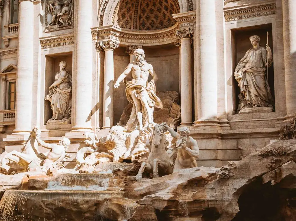 Detailed view of Trevi Fountain in Rome showcasing intricate sculptures and cascading water, a popular tourist attraction in Italy